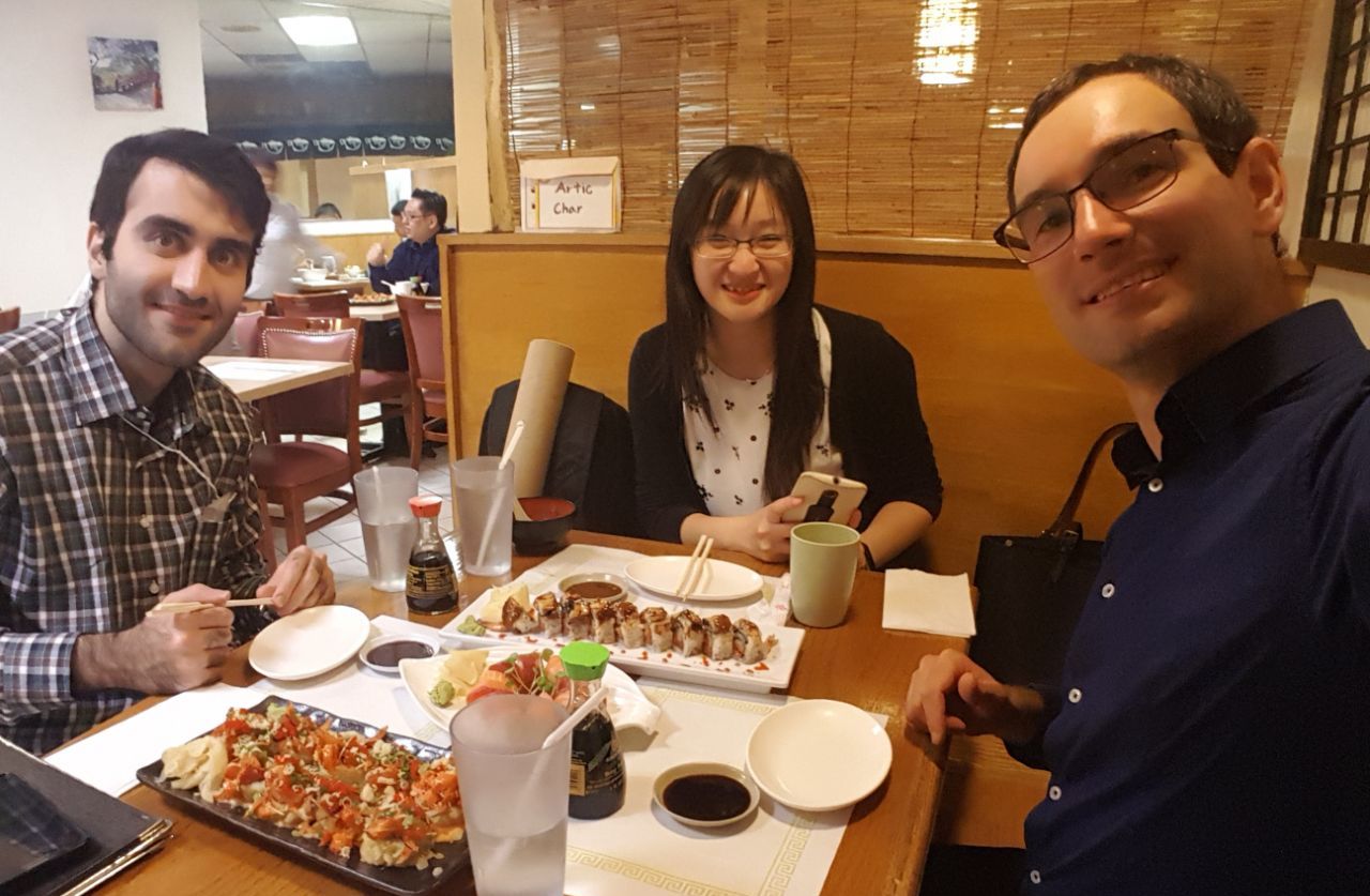 Photo of Mohammad, Liang, and Cristian at a restaurant